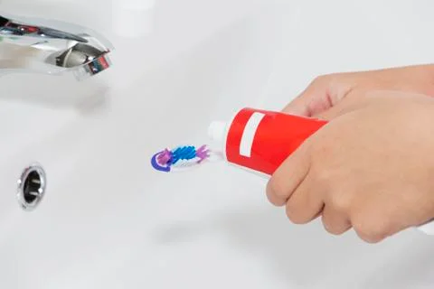 Toothpaste on a toothbrush, close-up. teeth care. Foto stock