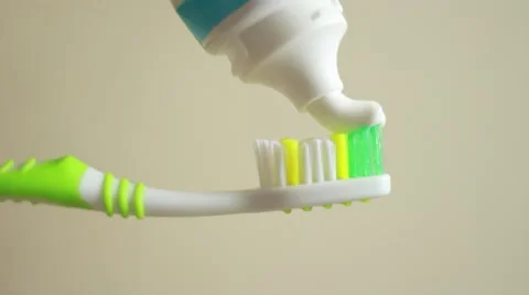 Toothpaste on a toothbrush Stock Footage