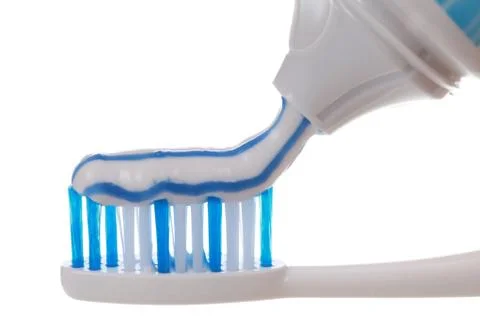 Toothpaste on a toothbrush Stock Photos