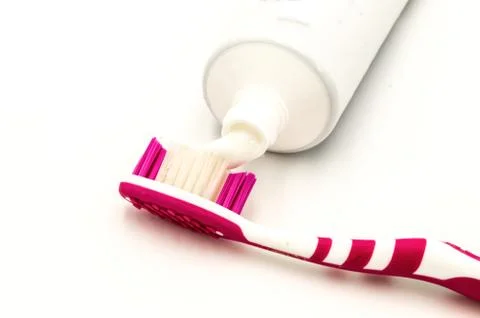 Toothpaste on a toothbrush Stock Photos