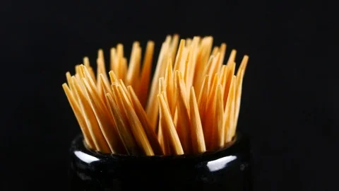 Toothpick on black background Stock Footage 87399527