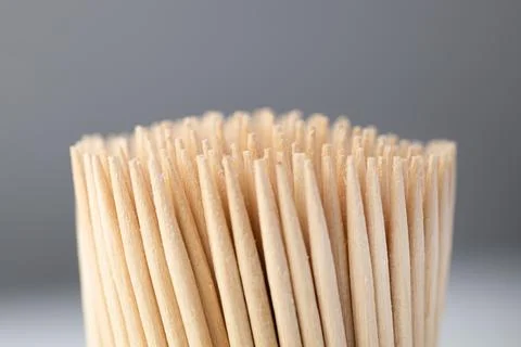 Toothpicks in a box on a gray background, close-up Stock Photos