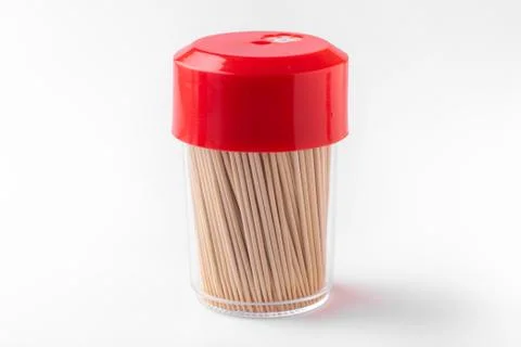 Toothpicks in a box on a white background. Closed bottle with toothpicks Stock Photos
