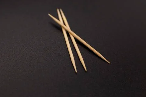 Toothpicks on a dark background. close up Stock Photos