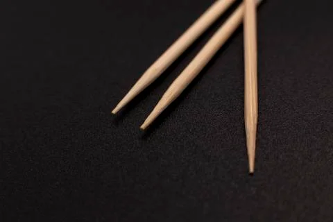 Toothpicks on a dark background. close up Stock Photos