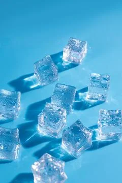 Top above overhead close up macro view photo of ice cubes and water drops o.. Stock Photos