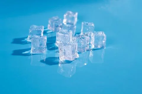 Top above overhead close up macro view photo of ice cubes and water drops o.. Stock Photos