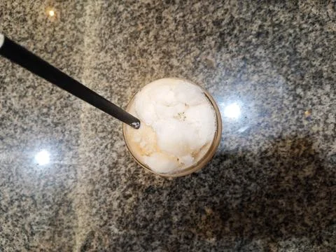 Top above overhead close up view photo of cold milk tea over ceramic table Stock Photos