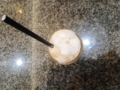 Top above overhead close up view photo of cold milk tea over ceramic table Fotos de archivo