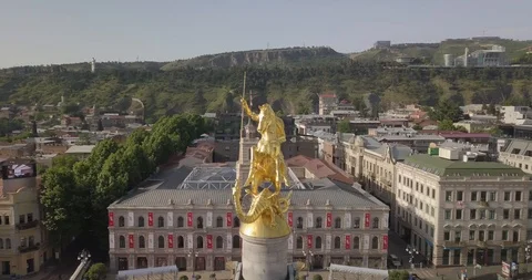Top Aerial close up spining around Golden statue of Saint George Stock Footage 108600054