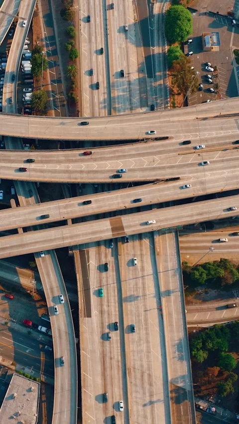 Top up aerial drone view of elevated road and traffic junctions in Los Angeles Stock Footage 312410947