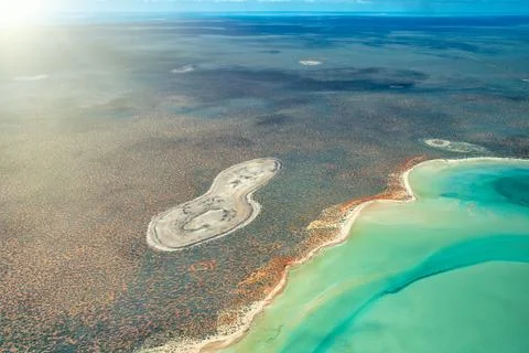 Top aerial landscape of Useless Loop showing geometric salt fields and remo.. Stock Photos
