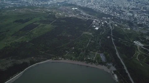 Top Aerial mixed camera moves and view Of The lake and the city Tbilisi Stock Footage 107973039
