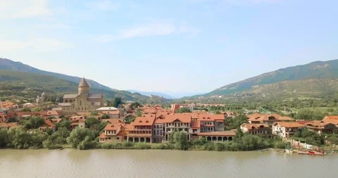 Top Aerial view of beautiful Mtskheta and Lake Mtkvari Stock Footage 110697154