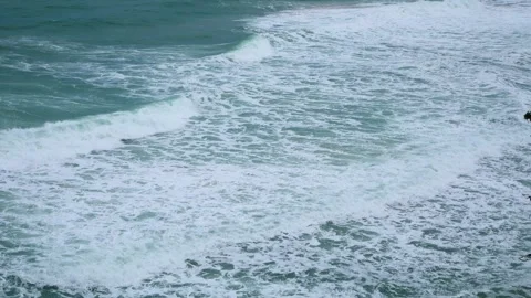 Top aerial view of big wave in sea coming to the beach in summer vacation h.. Stock Footage 276352824