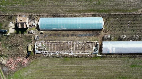 Top aerial view of devastated greenhouse Stock Footage 128013064