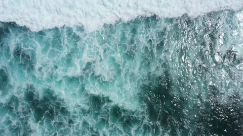 Top aerial view of giant ocean waves crashing and foaming. Amed, Bali Stock Footage 138466295
