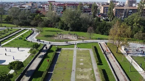 Top Aerial view of normal life routine in city park with couple jogging Stock Footage 166475470
