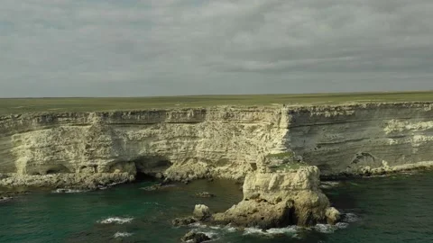 Top aerial view of ocean waves splash against rocks background. Stock Footage 143114017