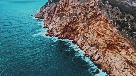 Top aerial view of ocean waves splash against rocks background Stock Footage 148749134