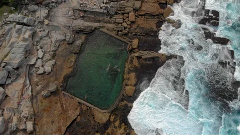 Top aerial view of a rock pool with waves crashing into it, Sydney, Australia,4K Stock Footage 105622342
