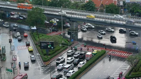 Top aerial view to the samyan intersection while traffic jam after raining .. Stock Footage 324704642