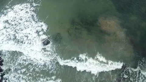 Top aerial view of sea waves crashing the shore Stock Footage 150401674