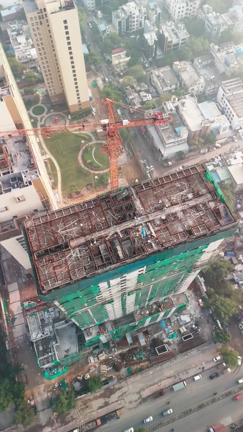 Top Aerial View Of Tower Crane On High Rise Building Under Construction Video stock 344268956