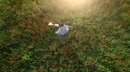 Top Aerial View Of Woman Dancing In The Poppy Field Stock Footage