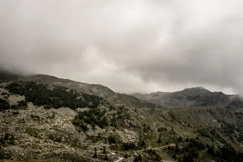 Top of alpine mountains with clouds Stock Photos