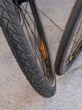 Top and close view of two bicycle  wheels with different types of (tires Stock Photos