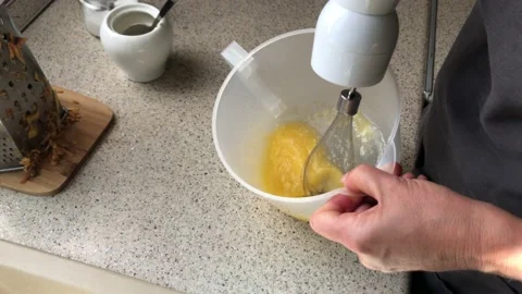 Top and close view on woman's hand mixing chicken eggs in bowl 스톡 동영상 162667776