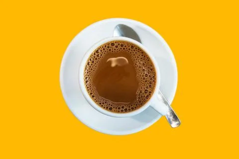 Top angle of a cup of coffee isolated on yellow background Stock Photos