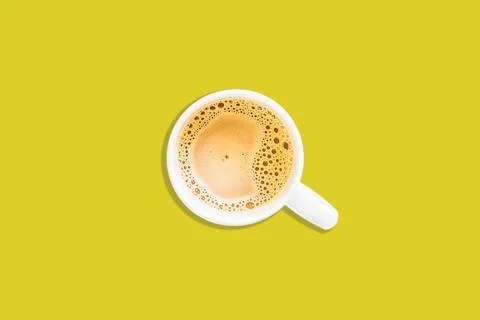 Top angle of a cup of coffee on yellow background Stock Photos
