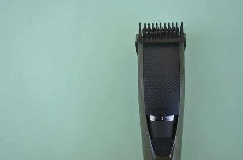 Top angle of front view of beard trimmer with attached comb with negative space Stock-Fotos