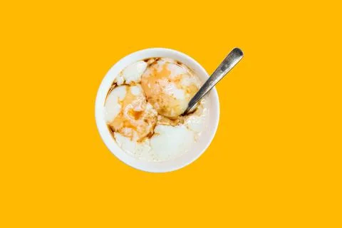 Top angle of half boiled egg isolated on yellow background Stock Photos