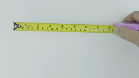 Top Angle Hand Opening Tape Measure for Measurement Concept Stock Footage 292045970