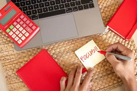 Top angle. Office concept. With hand writing focus word using red marker on y Stock Photos