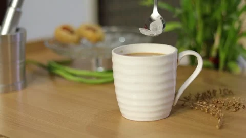Top angle of pouring refreshing tea in a white cup. Stock Footage 245096366