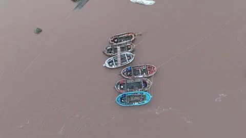 Top angle shot of boat in river. Muddy river water with boats aerial shot. Video stock 284226223