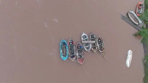 Top angle shot of boat in river. Muddy river water with boats aerial shot. Video stock 284226259