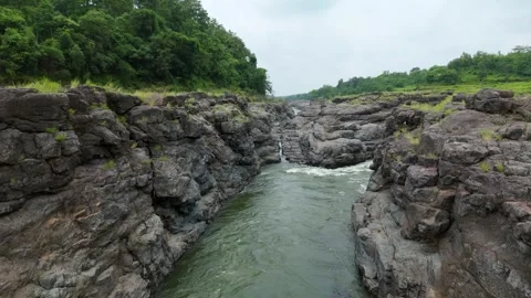 Top angle shot of Dam water flowing through the rock. Video stock 285430236