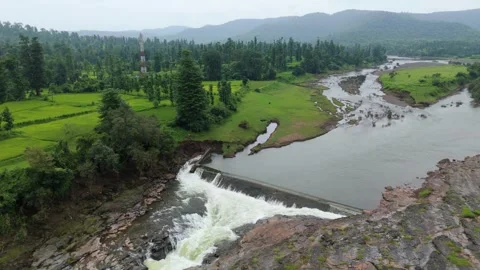 Top angle shot of Dam water flowing through the rock. Video stock 285476039