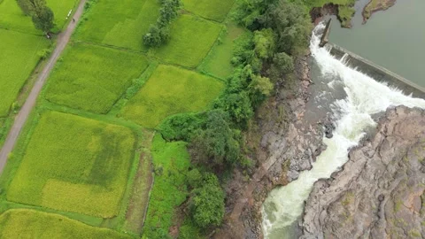 Top angle shot of Dam water flowing through the rock. Video stock 285476396