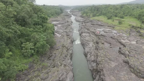 Top angle shot of Dam water flowing through the rock. Video stock 285476668
