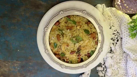 Top angle shot of Indian Snack chivda namkeen garnished with cashew and peanuts Stock Footage 287176863