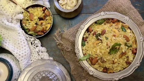 Top angle shot of Indian Snack chivda namkeen garnished with cashew and peanuts Stock Footage 287177028