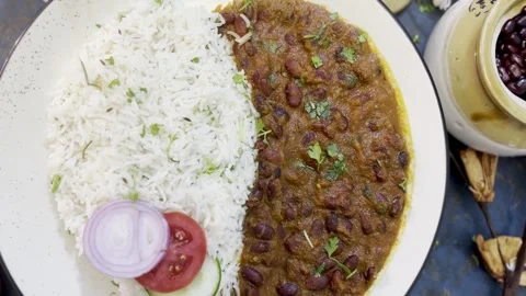 Top Angle shot of Rajma or kidney beans curry and rice in a ceramic plate. Stock Footage 287810875