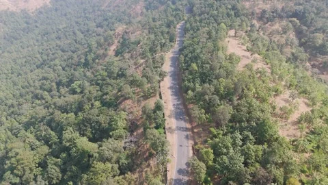 Top angle shot of roads in forest with mountain hills. Stock Footage 255365595