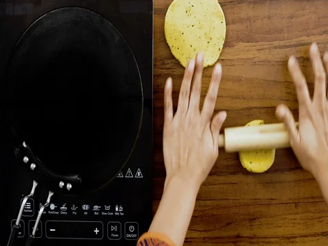 Top Angle shot -Rolling Out the Rotti using a Indian style Rolling Pin 库存影片 80419689